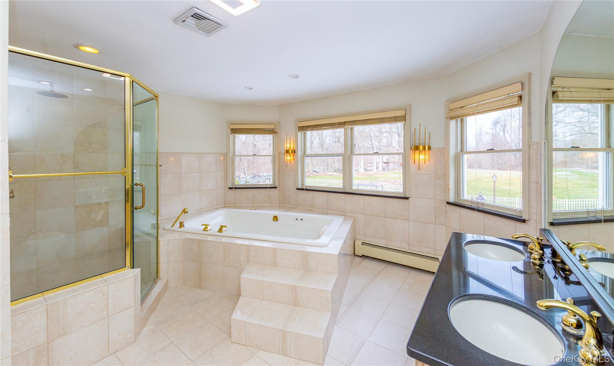 9 Caroline Drive Patterson, NY 12563 - Photo 27 of 50 Which leads to the spa-like en-suite bath.