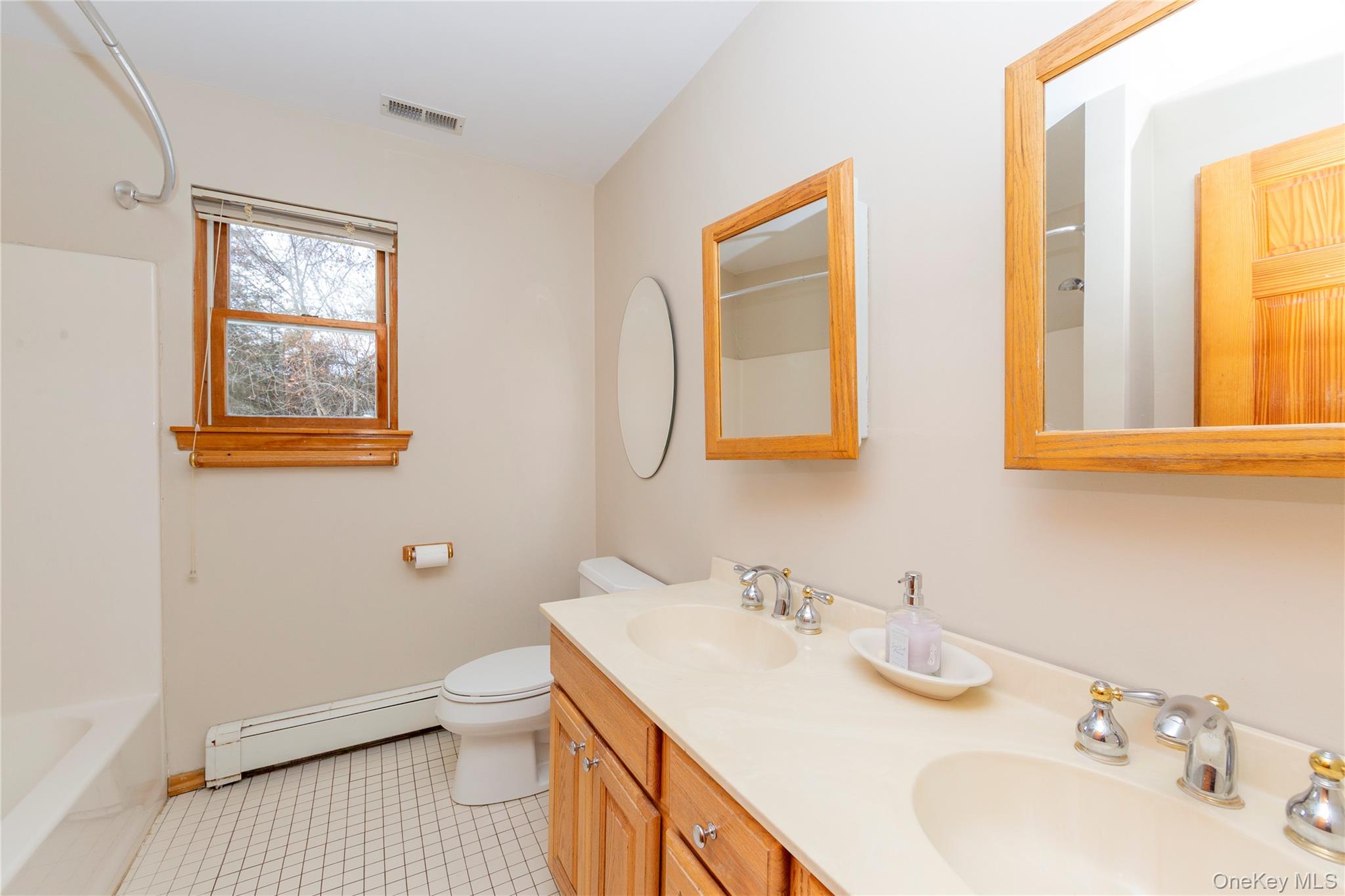 9 Caroline Drive Patterson, NY 12563 - Photo 36 of 50 Full hall bath with tub and double sink vanity.