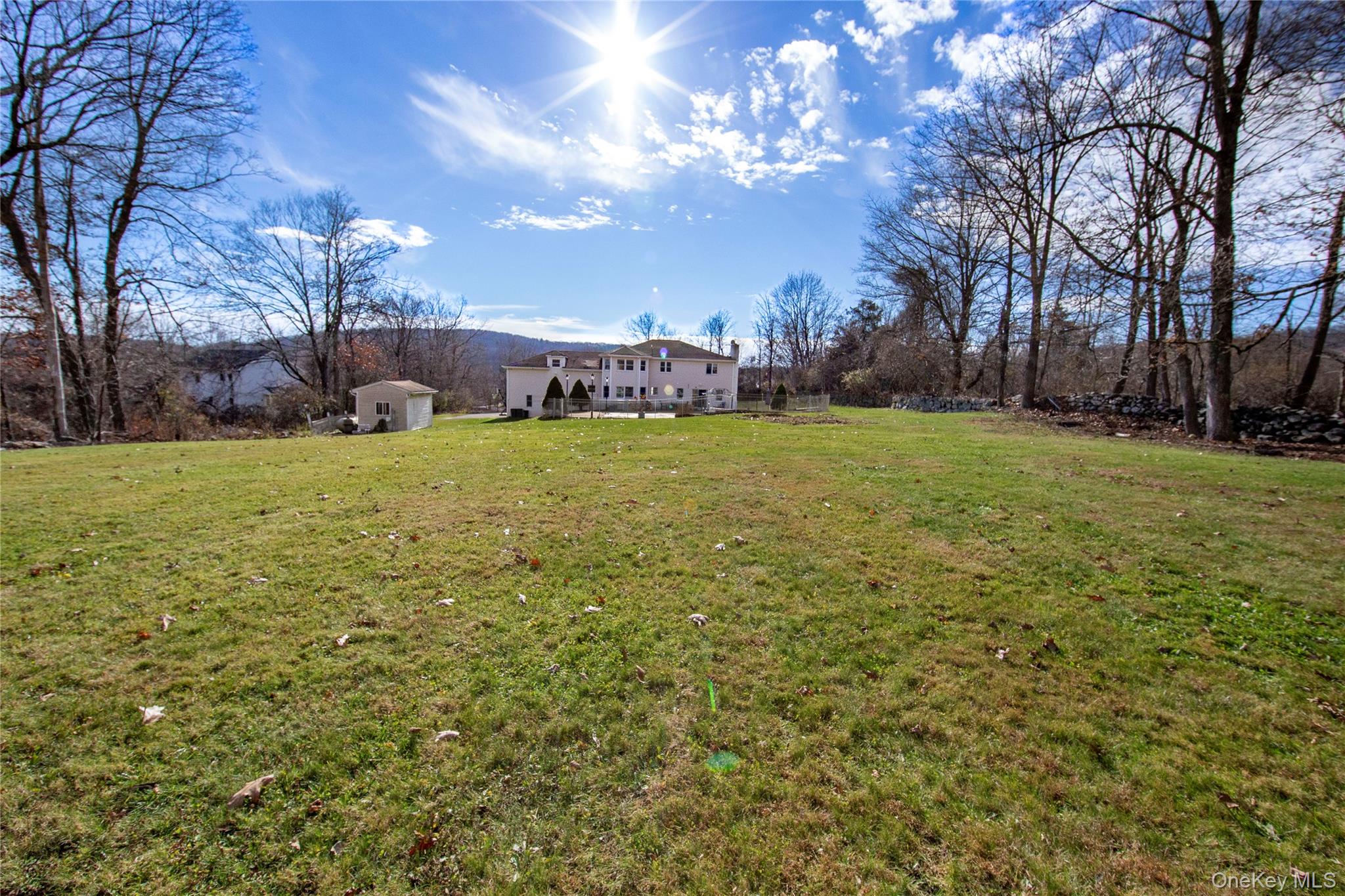 9 Caroline Drive Patterson, NY 12563 - Photo 44 of 50 View from the back of the yard looking towards the home.