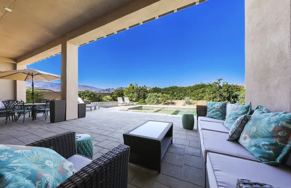a view of balcony with couches and city view