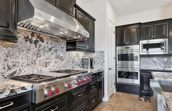 a kitchen with a stove and a microwave
