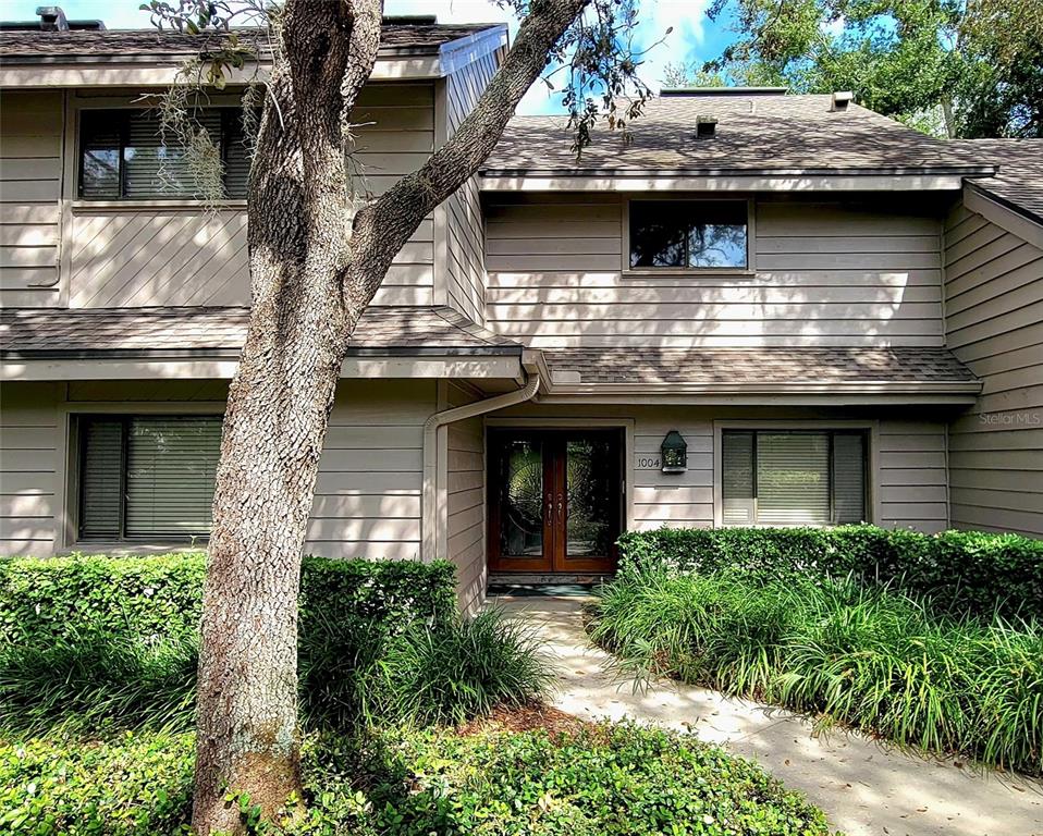 1004 Old Mill Pond Road Palm Harbor, FL 34683 - Photo 3 of 48 a view of a house with a large windows