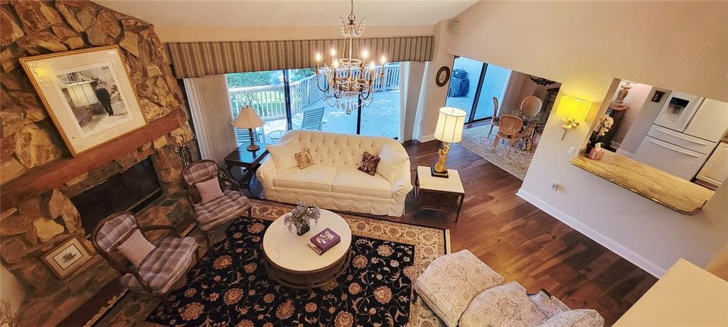 1004 Old Mill Pond Road Palm Harbor, FL 34683 - Photo 33 of 48 a living room with furniture and a large window