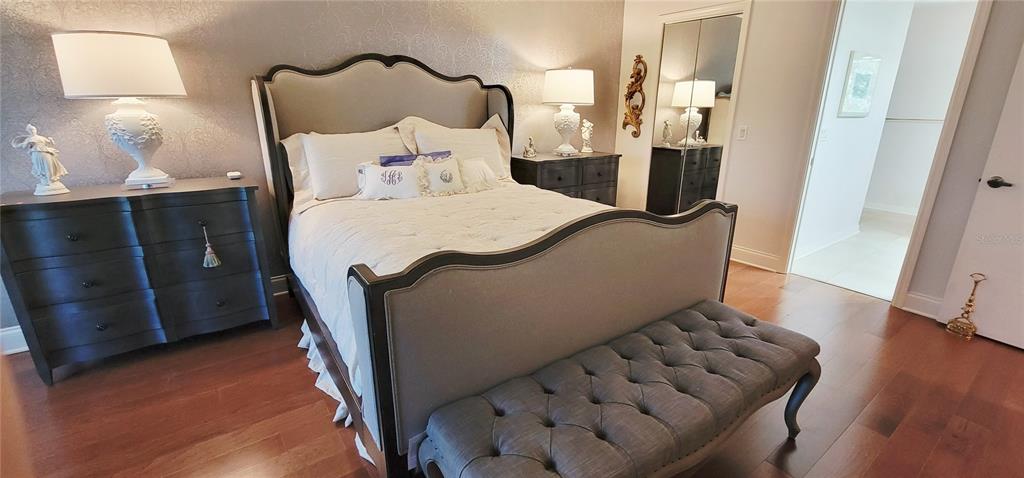 1004 Old Mill Pond Road Palm Harbor, FL 34683 - Photo 35 of 48 a bed room with a bed and a night stand