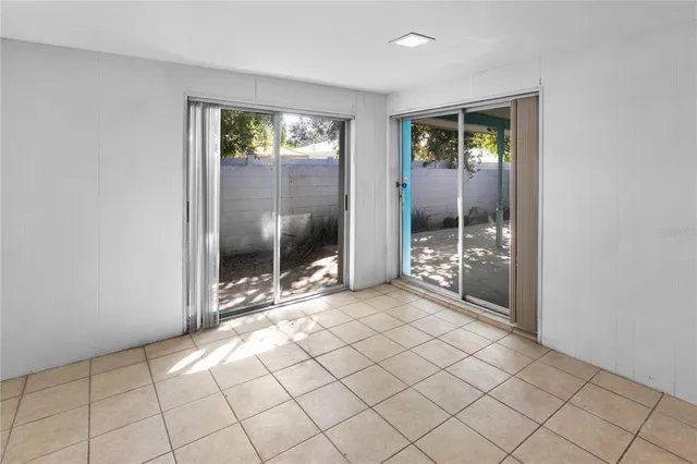 a bedroom with bed and a window