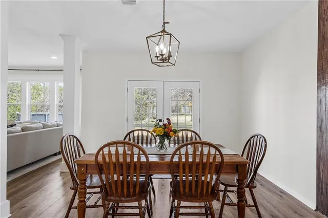 a view of a dining room with furniture window and wooden floor