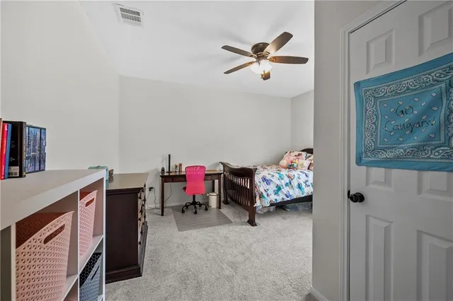 a bedroom with furniture and a bed