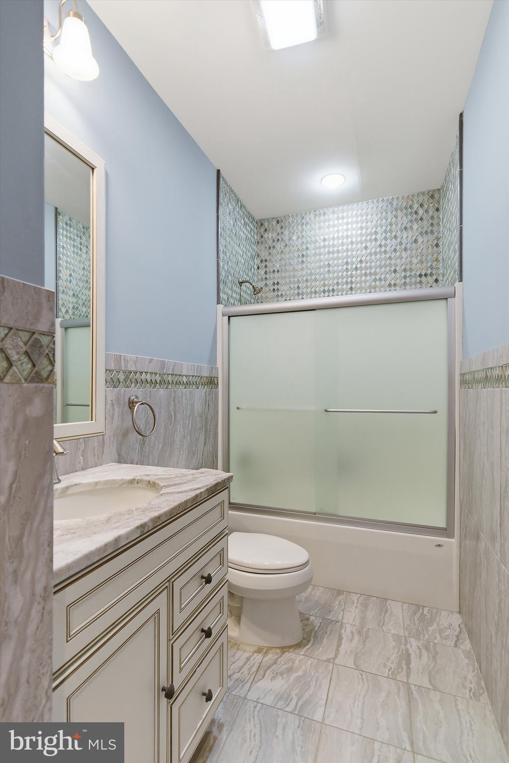 23 East Pimlico Road Little Egg Harbor, NJ 08087 - Photo 15 of 43 a bathroom with a granite countertop sink mirror vanity and toilet