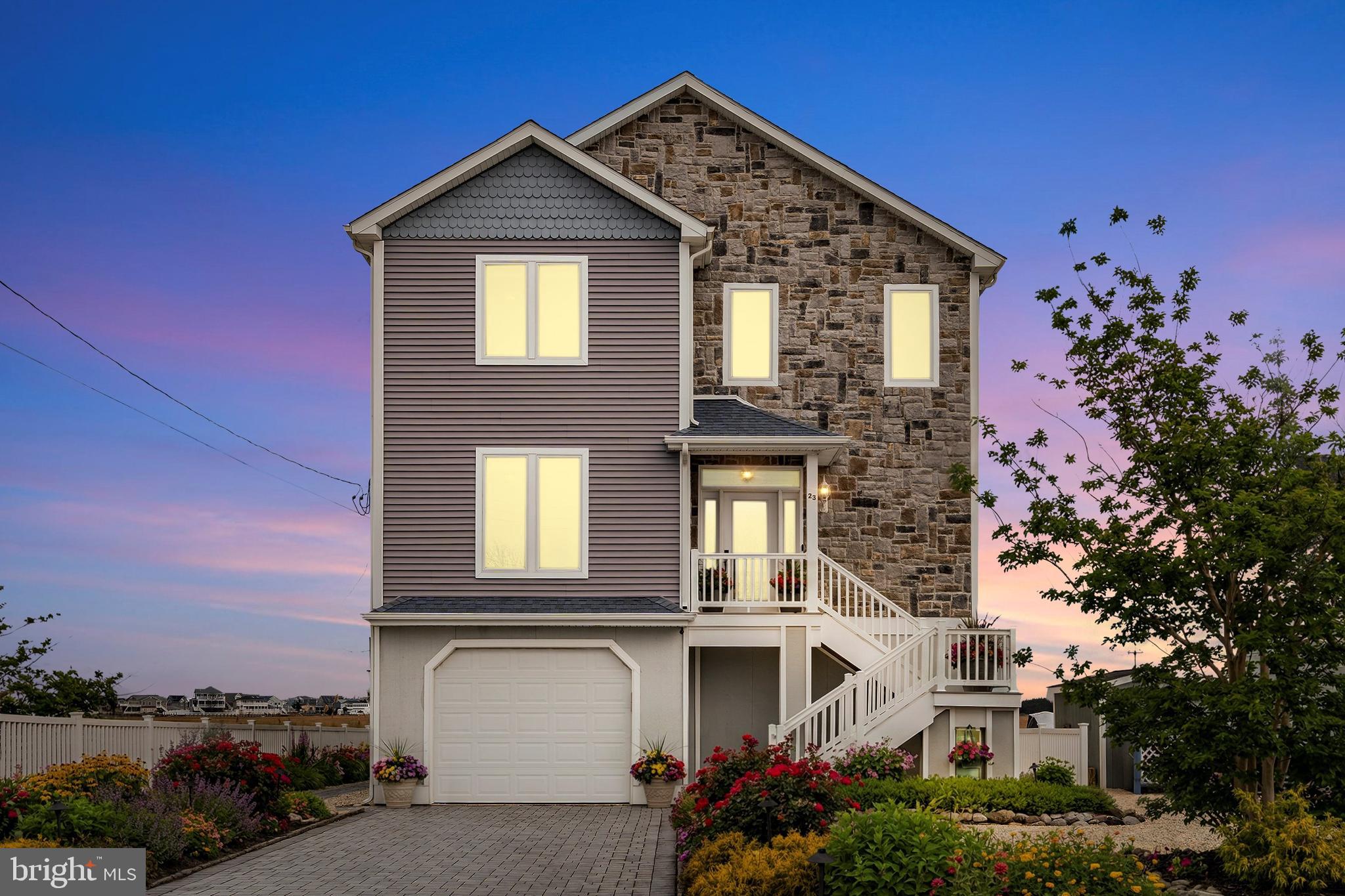 23 East Pimlico Road Little Egg Harbor, NJ 08087 - Photo 2 of 43 front view of a house with a small yard