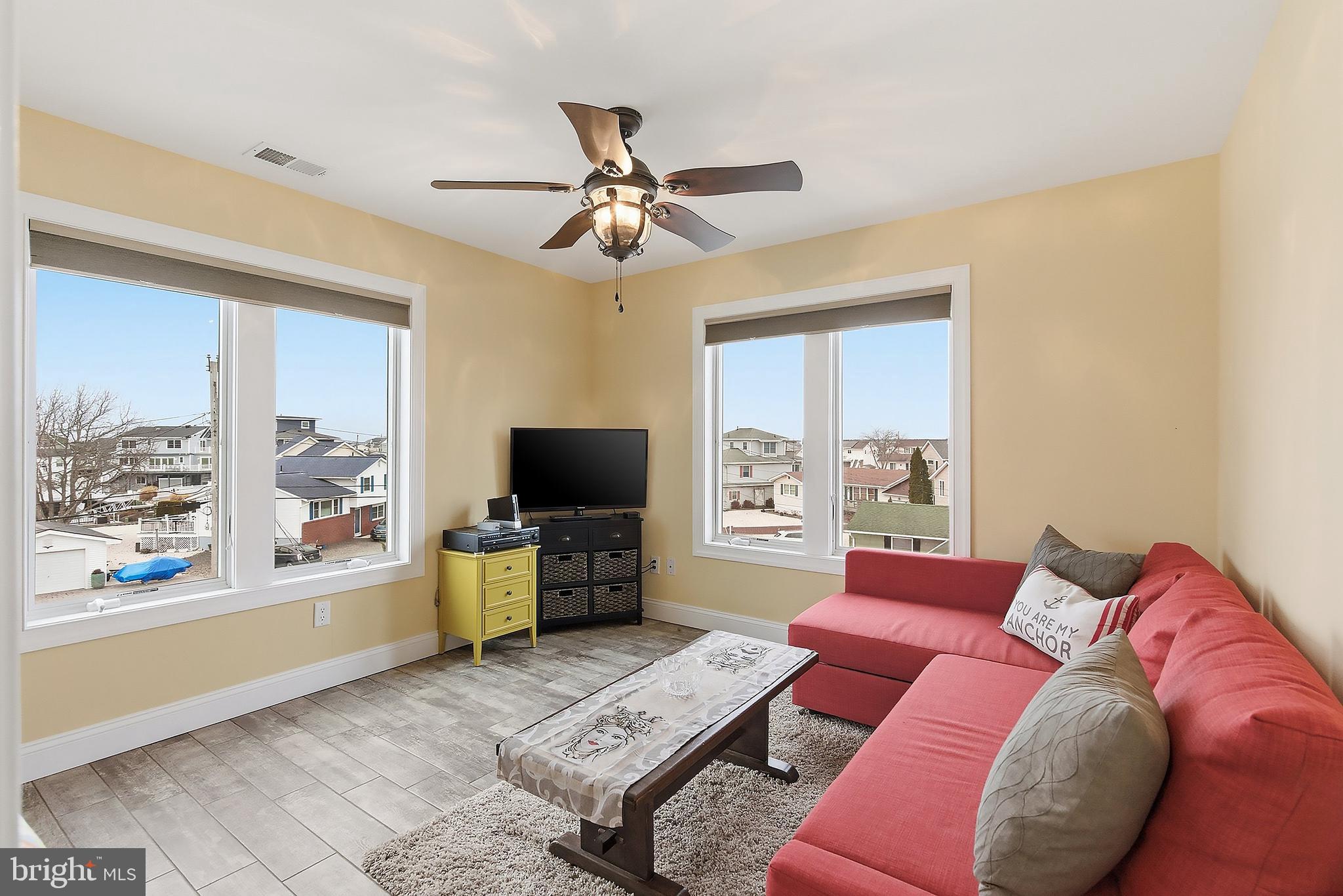 23 East Pimlico Road Little Egg Harbor, NJ 08087 - Photo 21 of 43 a living room with furniture and a flat screen tv