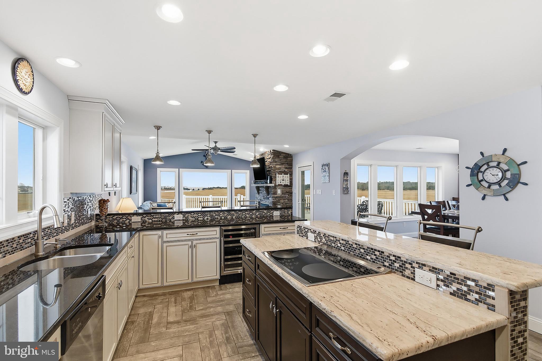 23 East Pimlico Road Little Egg Harbor, NJ 08087 - Photo 28 of 43 a kitchen with a stove a sink a refrigerator and cabinets