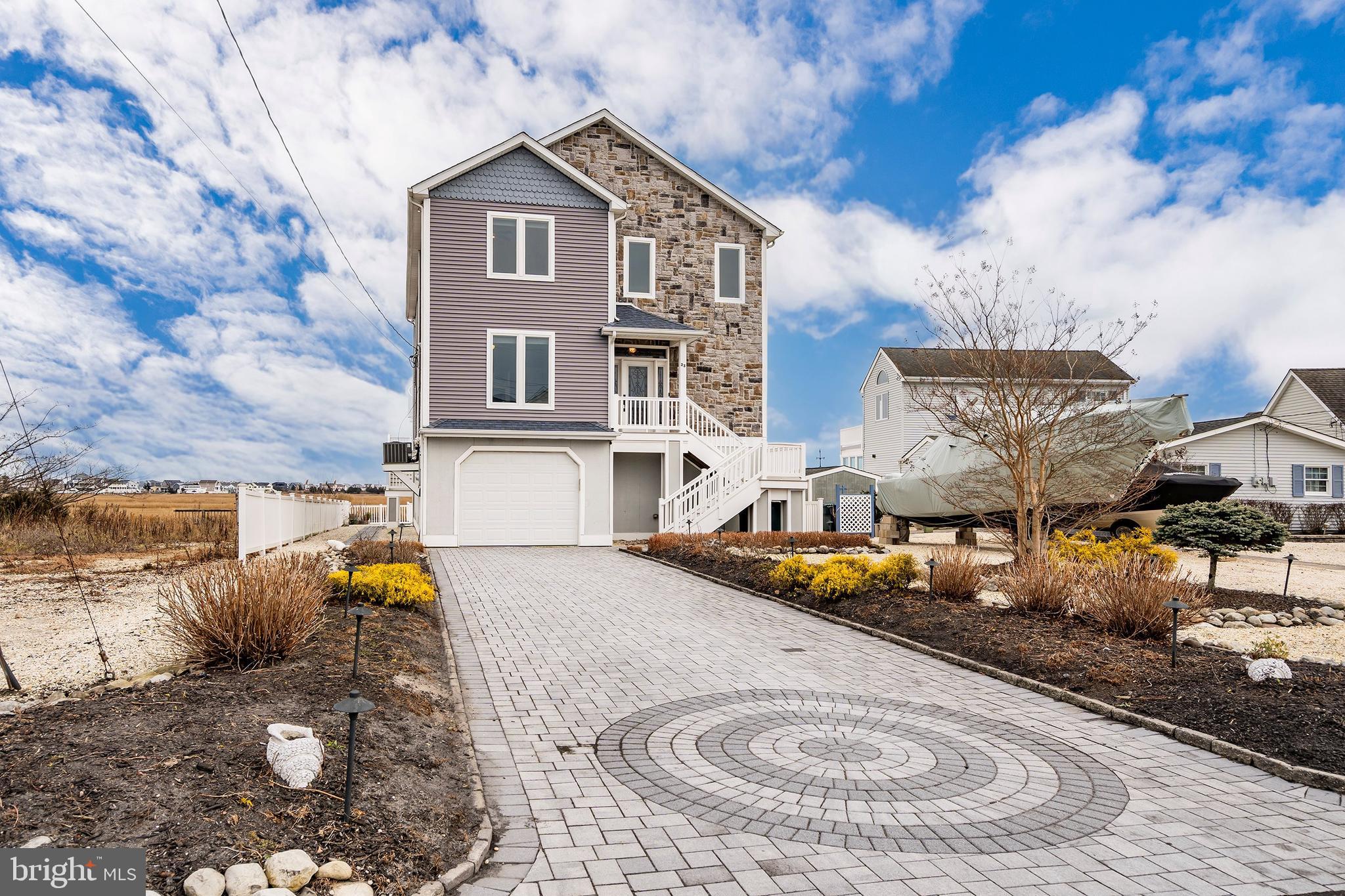 23 East Pimlico Road Little Egg Harbor, NJ 08087 - Photo 3 of 43 a front view of a house with garden