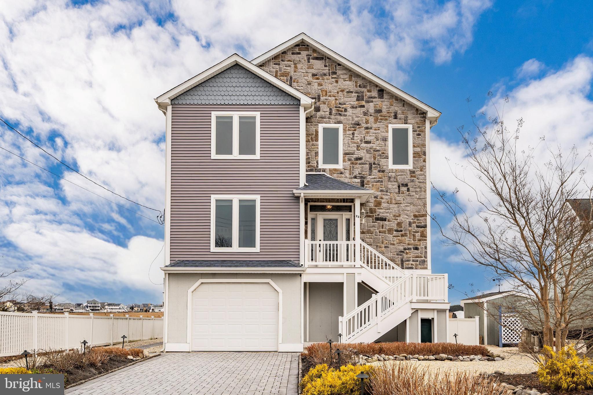 23 East Pimlico Road Little Egg Harbor, NJ 08087 - Photo 4 of 43 a view of a big house with many windows