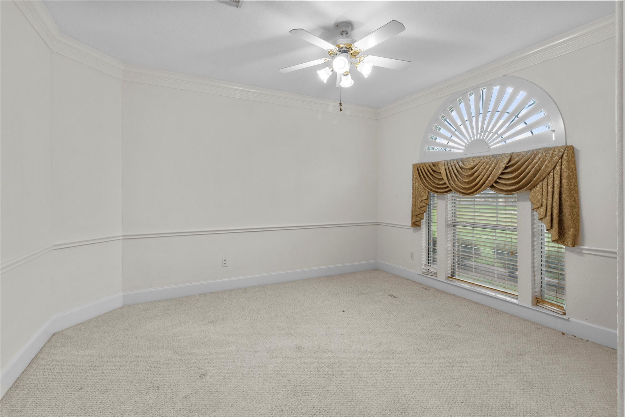 10302 Hanselman Road, Unit CR69 Manvel, TX 77578 - Photo 11 of 37 an empty room with a chandelier fan