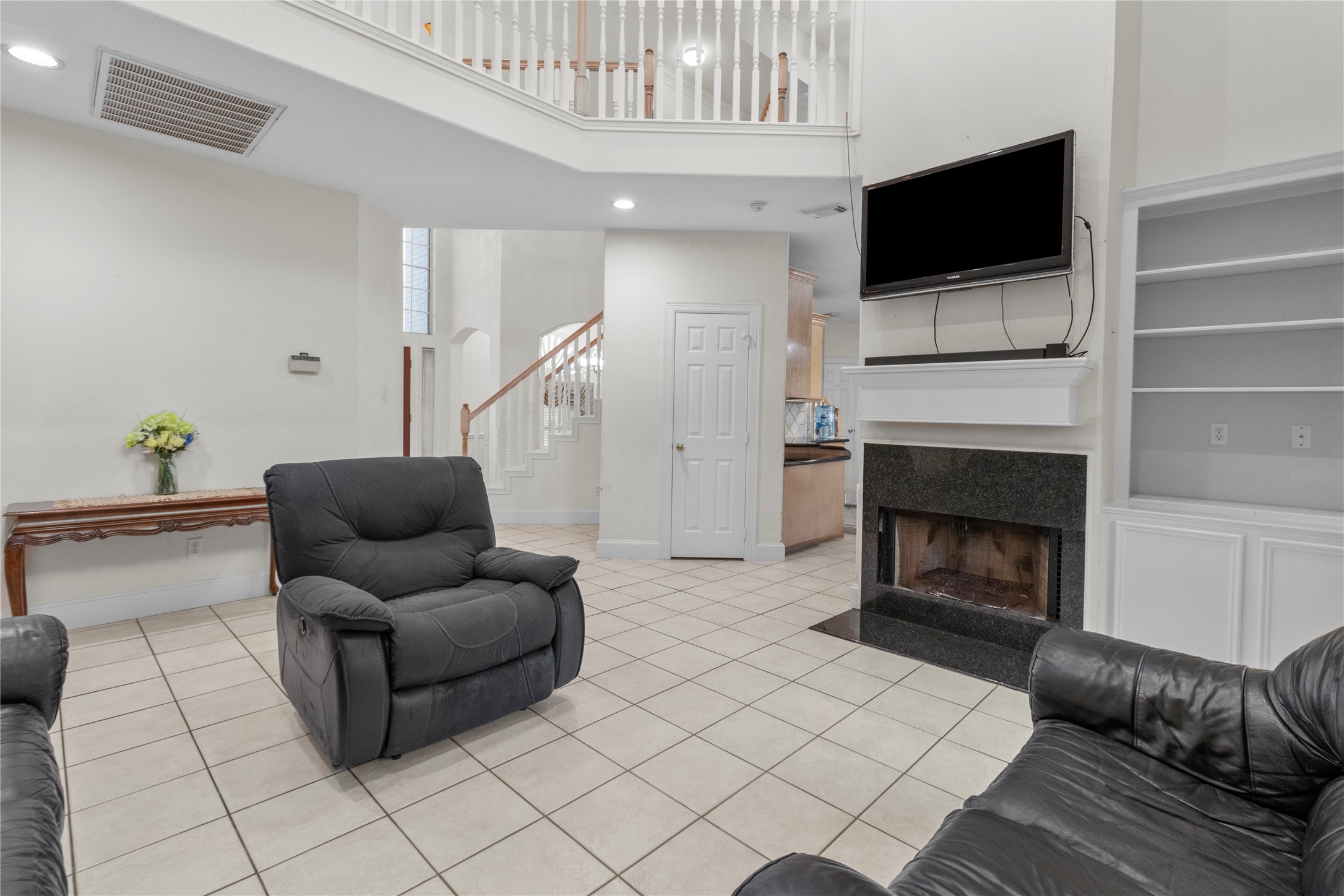 10302 Hanselman Road, Unit CR69 Manvel, TX 77578 - Photo 13 of 37 a living room with furniture and a flat screen tv