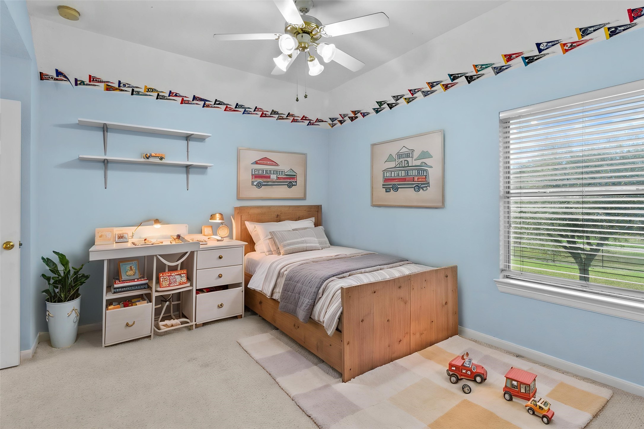 10302 Hanselman Road, Unit CR69 Manvel, TX 77578 - Photo 22 of 37 a bedroom with a bed and a chandelier