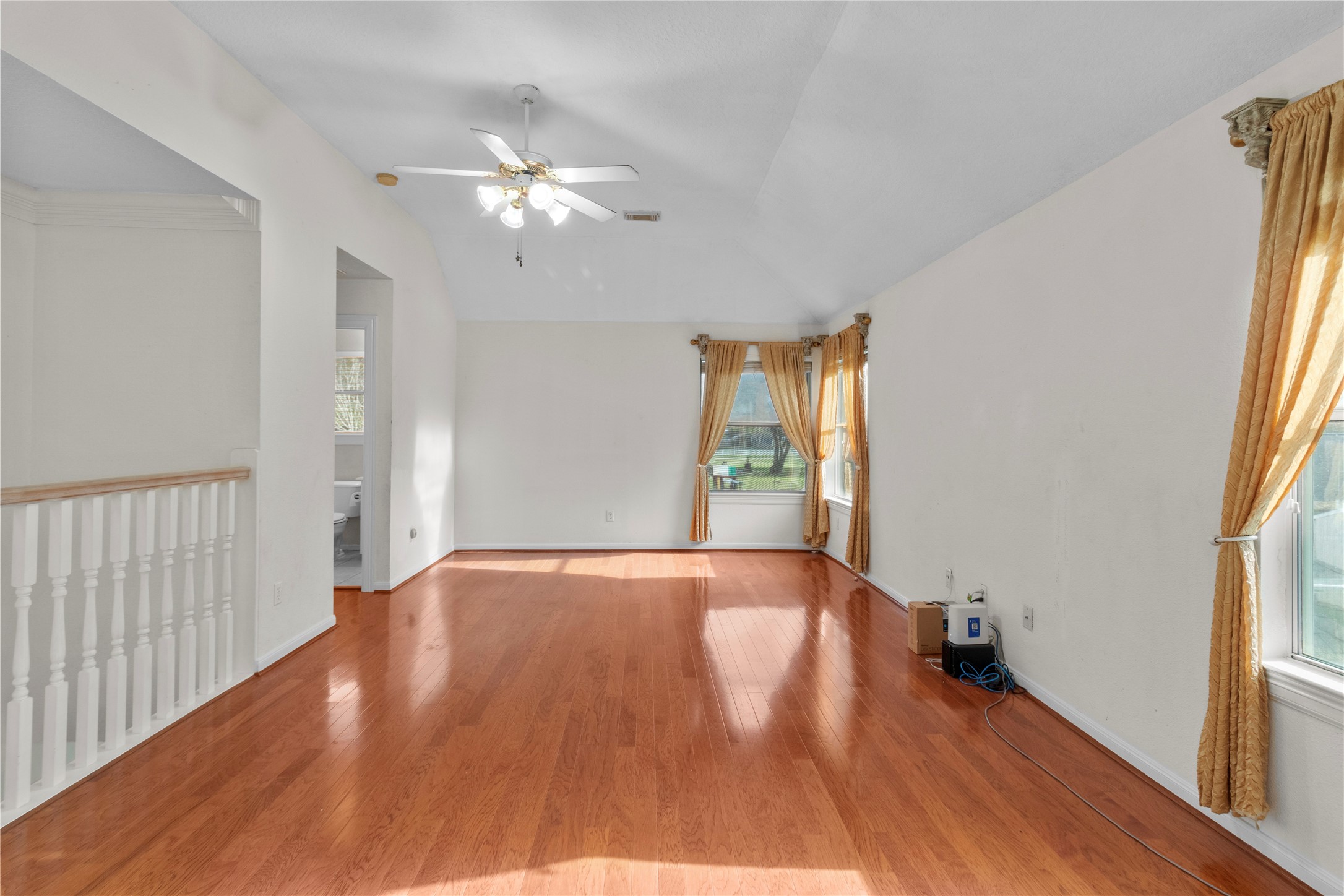 10302 Hanselman Road, Unit CR69 Manvel, TX 77578 - Photo 26 of 37 a view of an empty room with wooden floor and a window