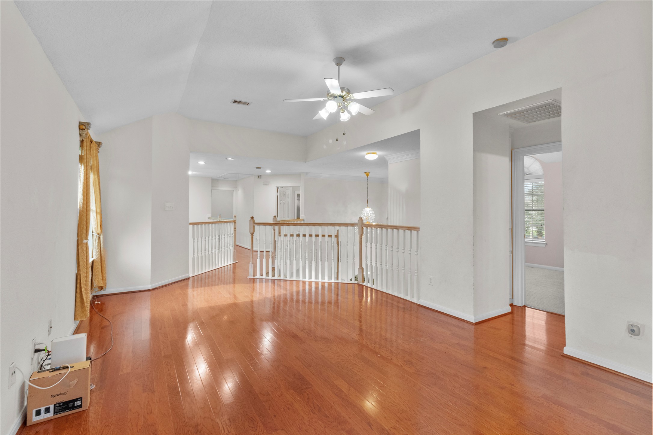 10302 Hanselman Road, Unit CR69 Manvel, TX 77578 - Photo 27 of 37 a view of an empty room with wooden floor and a cabinet