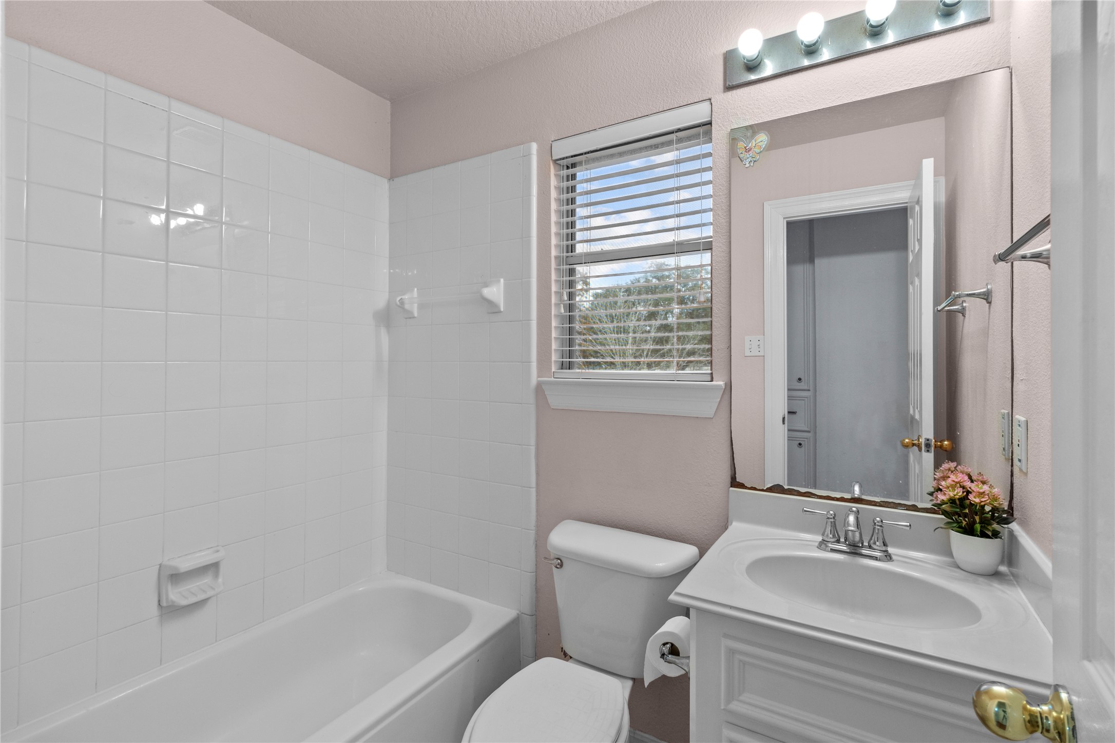 10302 Hanselman Road, Unit CR69 Manvel, TX 77578 - Photo 28 of 37 a bathroom with a sink toilet and shower