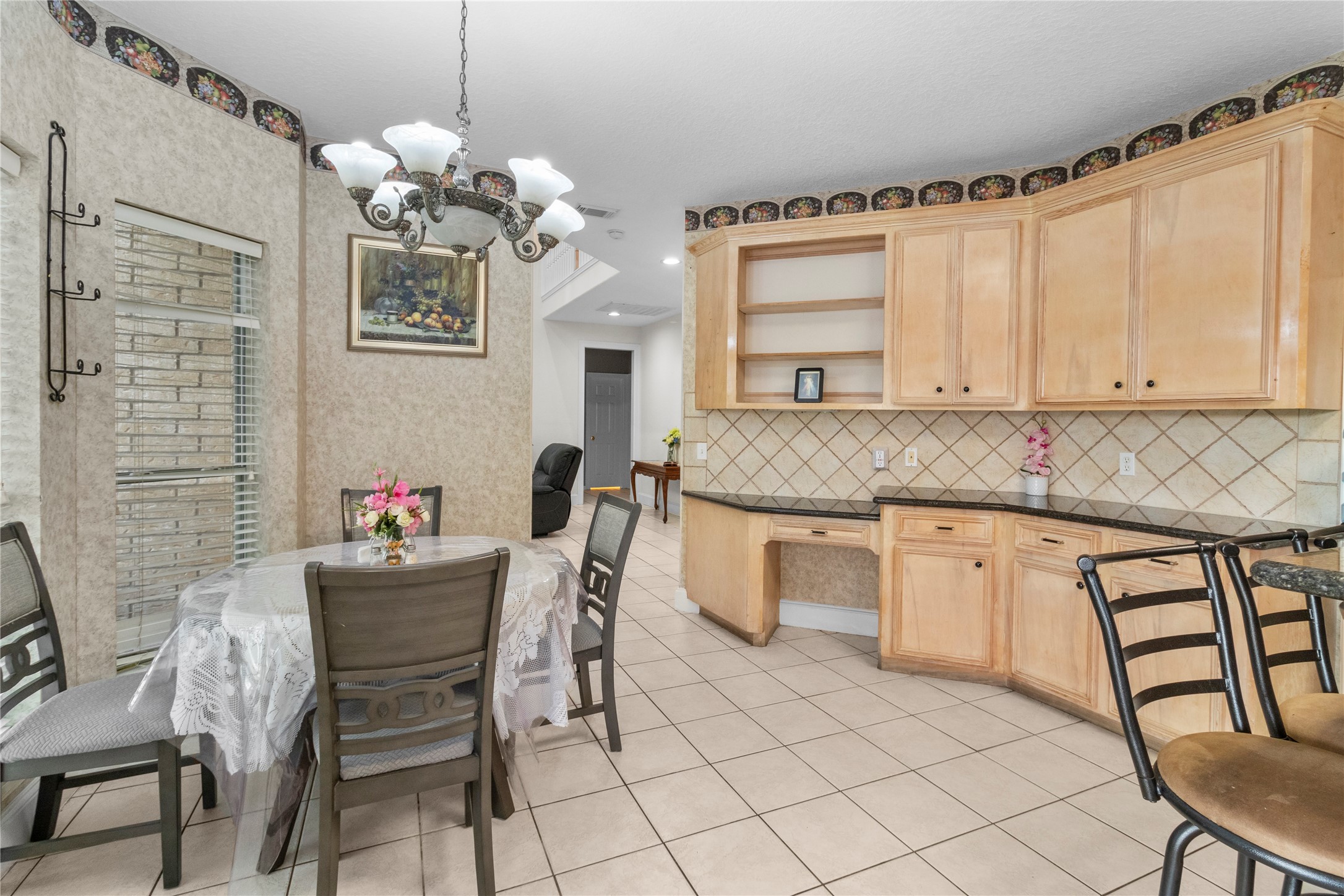 10302 Hanselman Road, Unit CR69 Manvel, TX 77578 - Photo 35 of 37 a kitchen with stainless steel appliances granite countertop a white cabinets a sink and a white wooden cabinets
