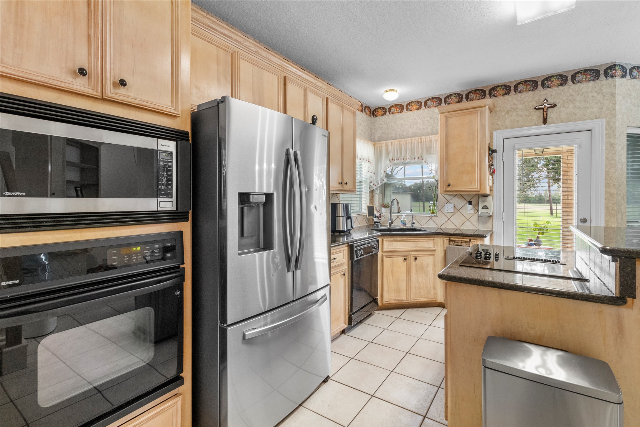 10302 Hanselman Road, Unit CR69 Manvel, TX 77578 - Photo 36 of 37 a kitchen with a refrigerator sink and microwave