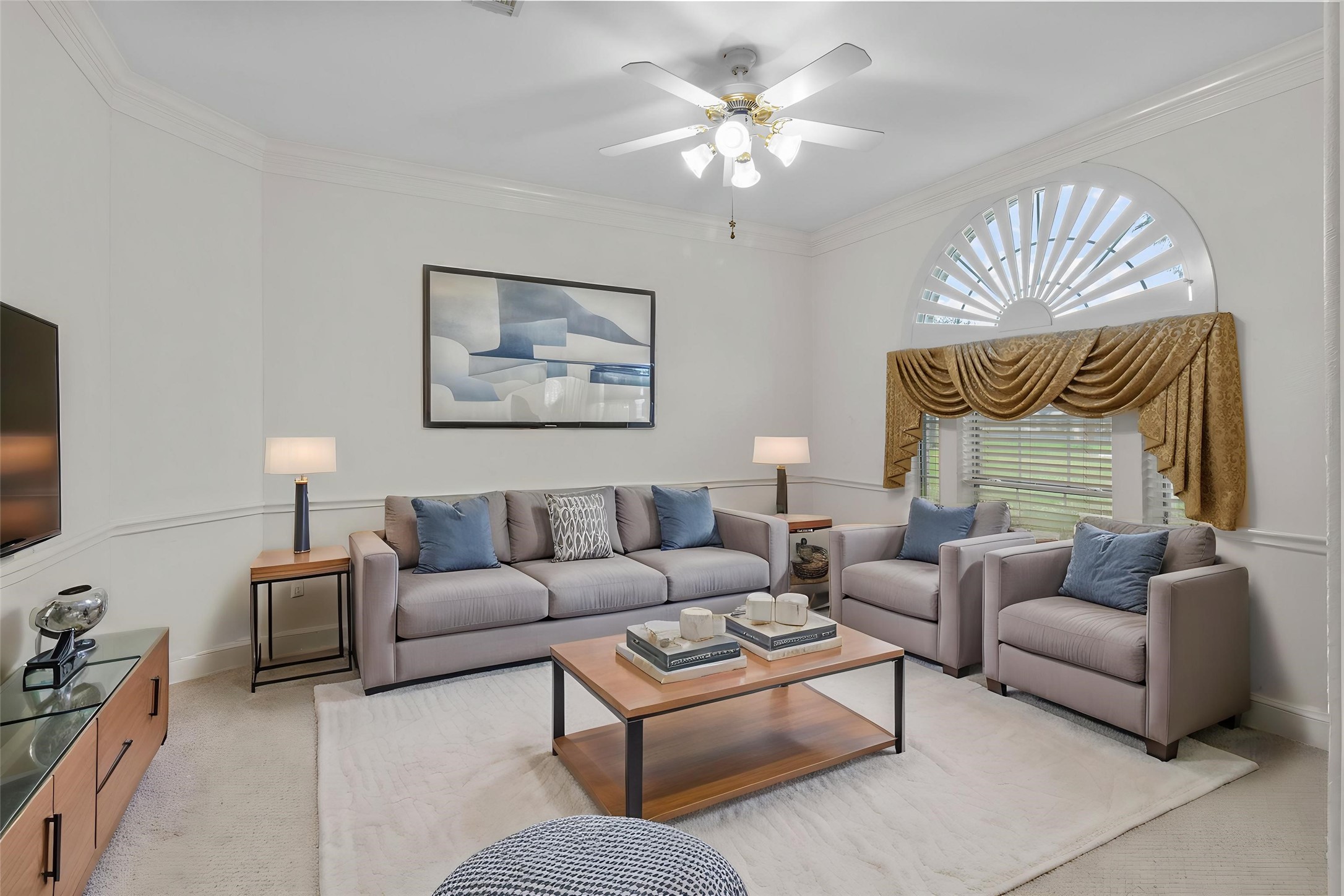 10302 Hanselman Road, Unit CR69 Manvel, TX 77578 - Photo 10 of 37 a living room with furniture ceiling fan and a rug