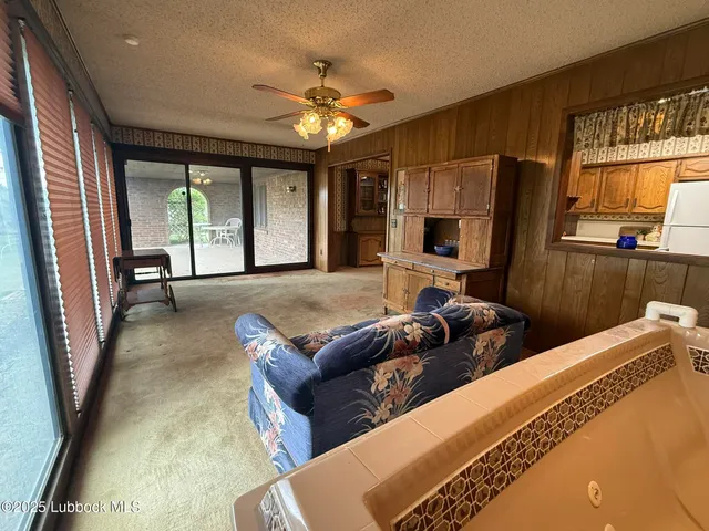 a bed room with a bed window and a flat tv screen
