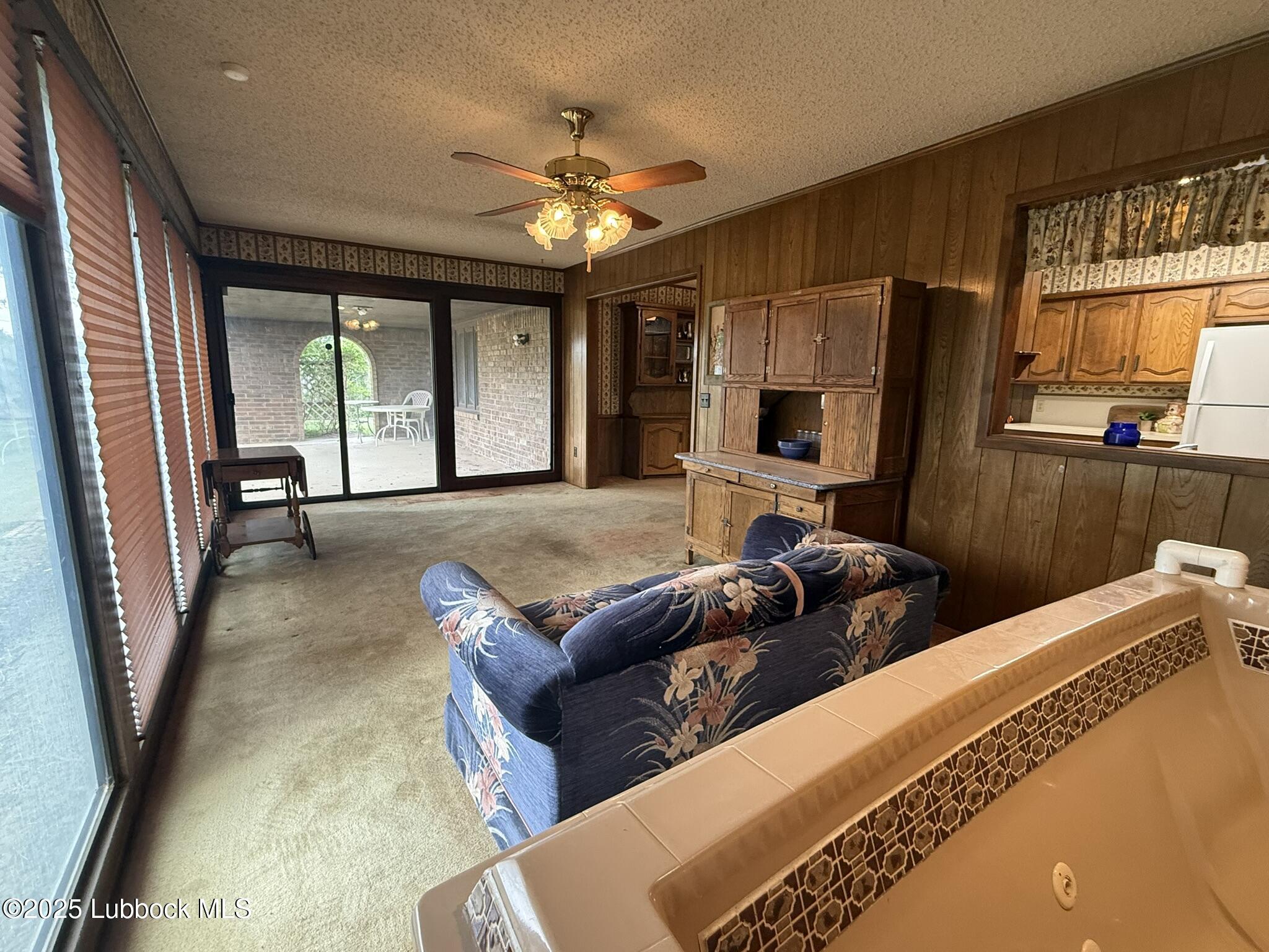 101 Dana Avenue Earth, TX 79031 - Photo 14 of 29 a living room with furniture and a flat screen tv