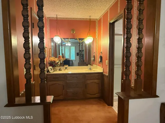 a bathroom with a sink a toilet and mirror