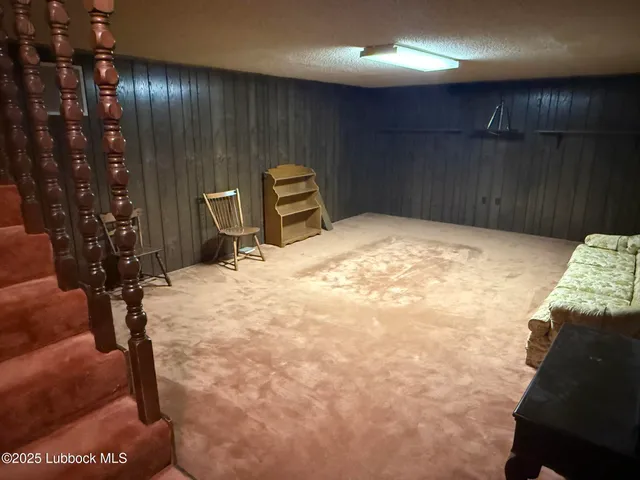 a bathroom with a granite countertop sink and a large mirror
