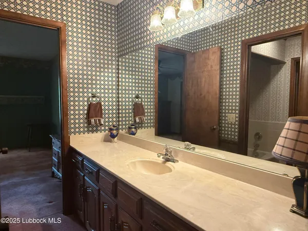 a view of a livingroom with window and a ceiling fan