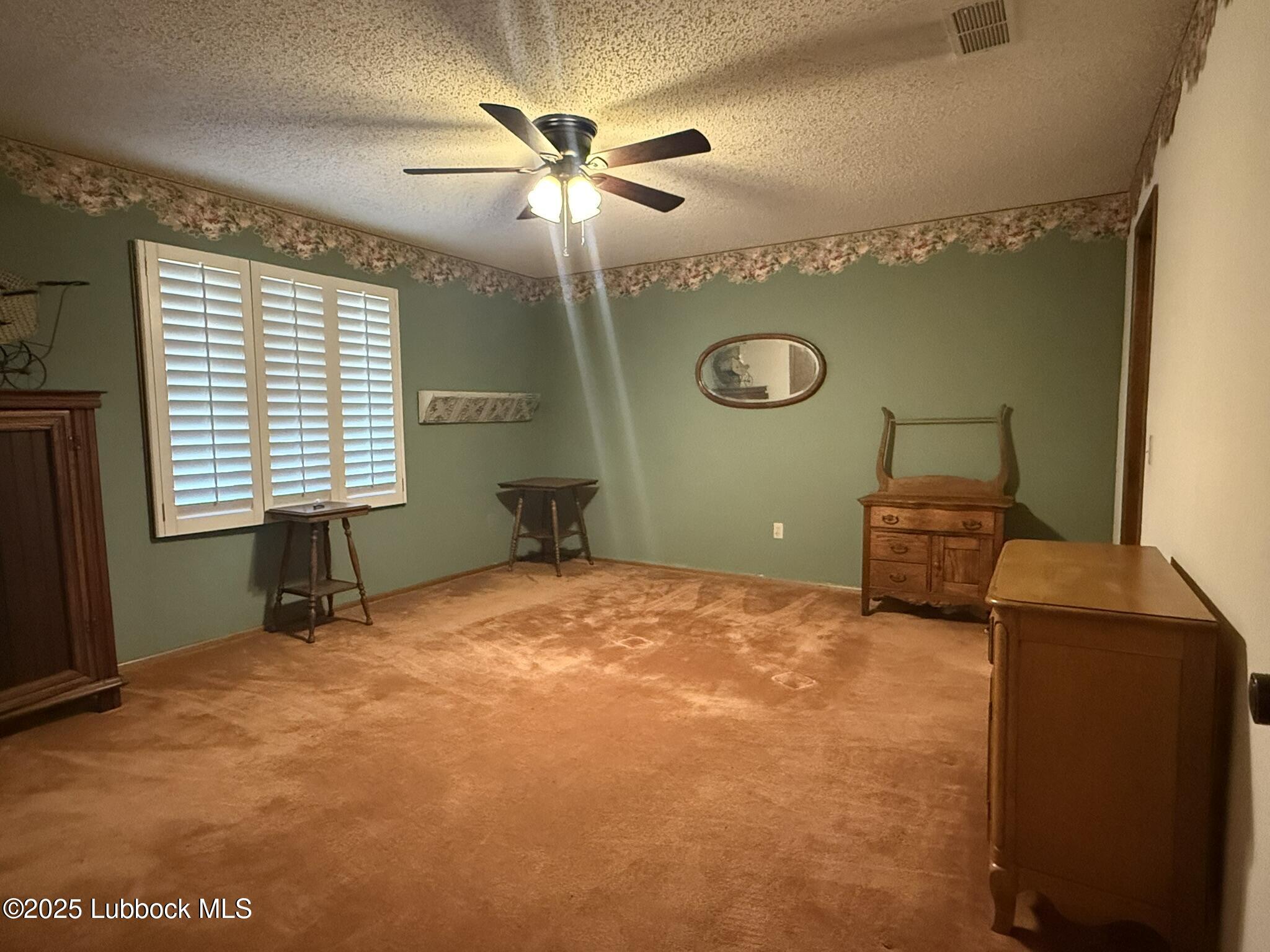 101 Dana Avenue Earth, TX 79031 - Photo 28 of 29 a bedroom with a bed and a window