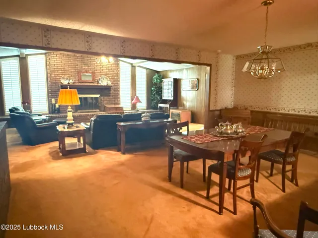 a dining room with furniture window and garden view