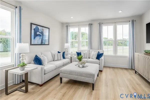 a living room with furniture and a large window