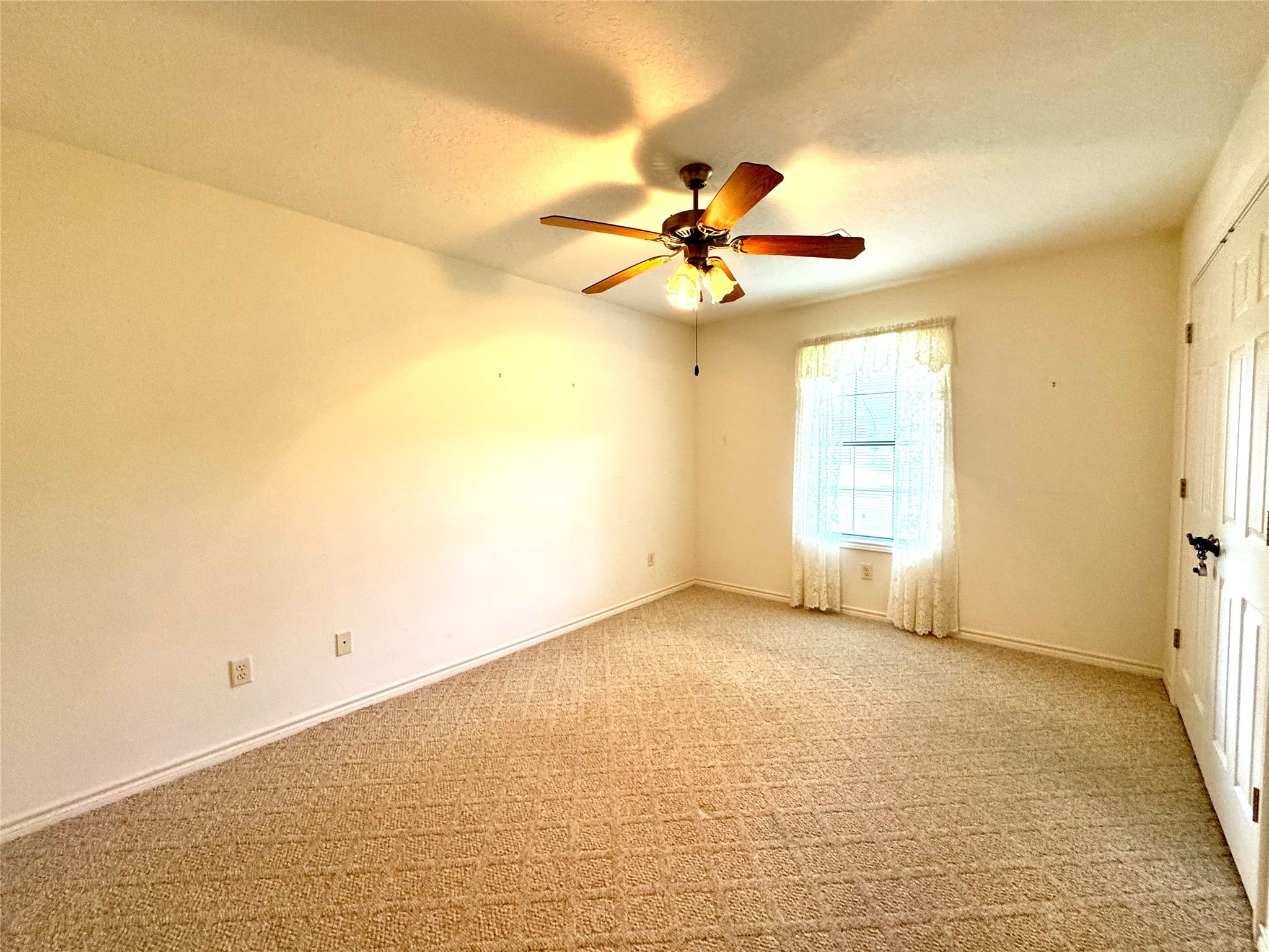 20 Shallow Springs Trinity, TX 75862 - Photo 38 of 48 an empty room with windows and fan