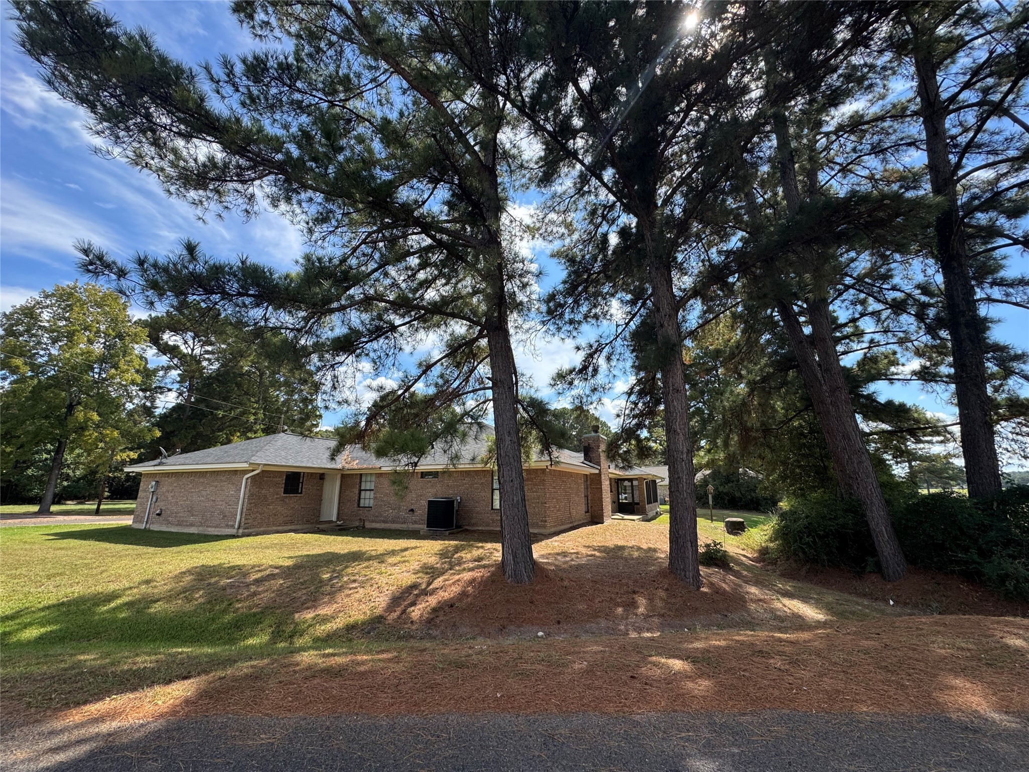 20 Shallow Springs Trinity, TX 75862 - Photo 46 of 48 a front view of a house with a yard