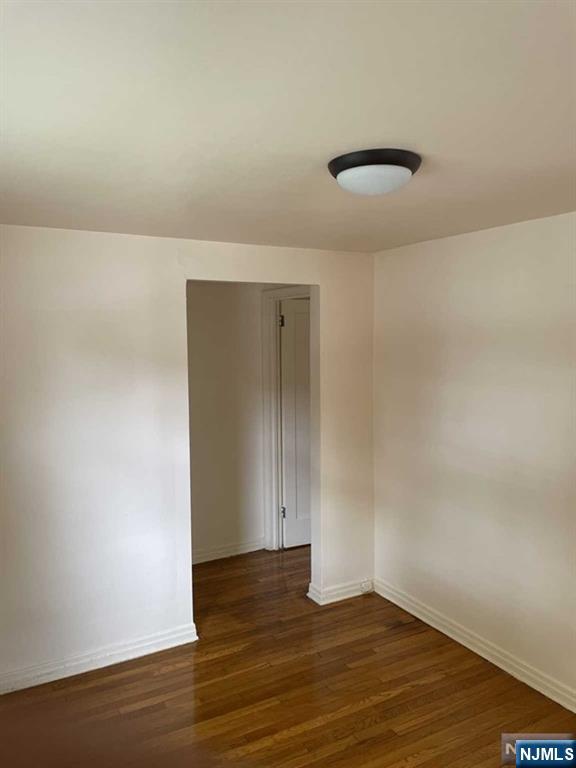 2 Mount Vernon Court Maywood, NJ 07607 - Photo 16 of 28 a view of an empty room with wooden floor and cabinet