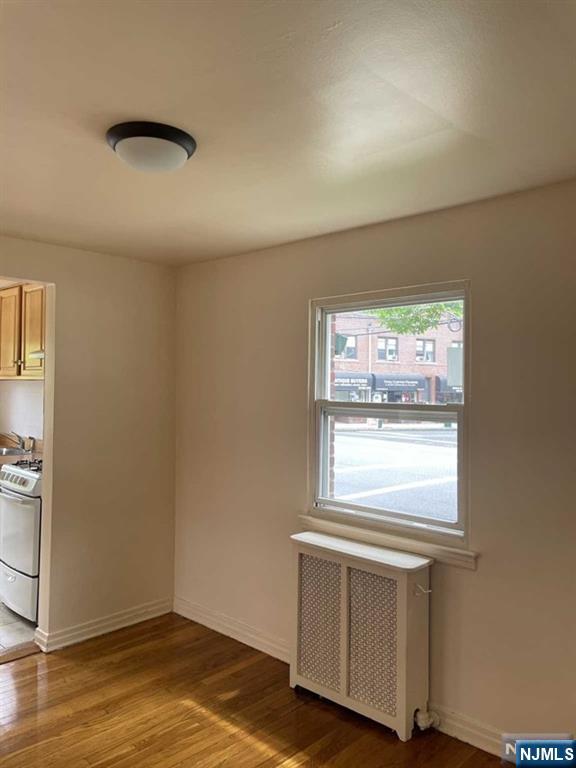 2 Mount Vernon Court Maywood, NJ 07607 - Photo 10 of 28 an empty room with wooden floor cabinet and windows