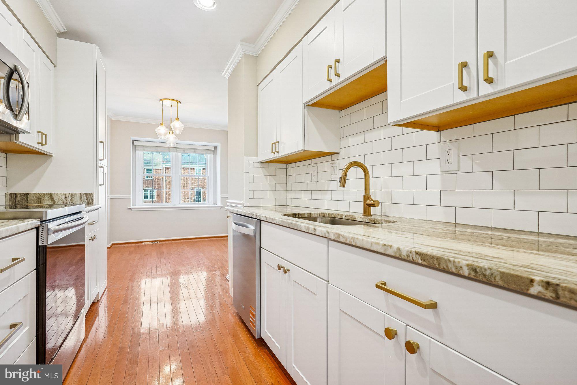 8826 Surveyors Place Springfield, VA 22152 - Photo 40 of 40 a kitchen with sink and cabinets