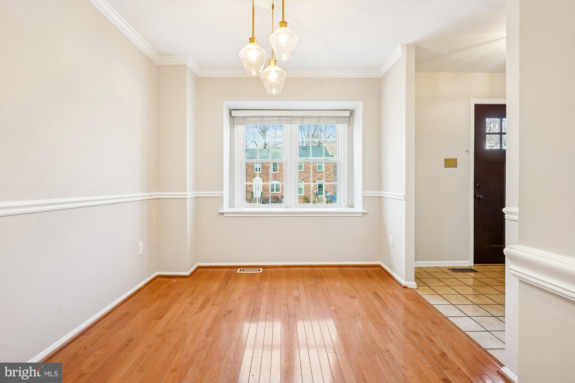 8826 Surveyors Place Springfield, VA 22152 - Photo 16 of 40 wooden floor in an empty room with a window
