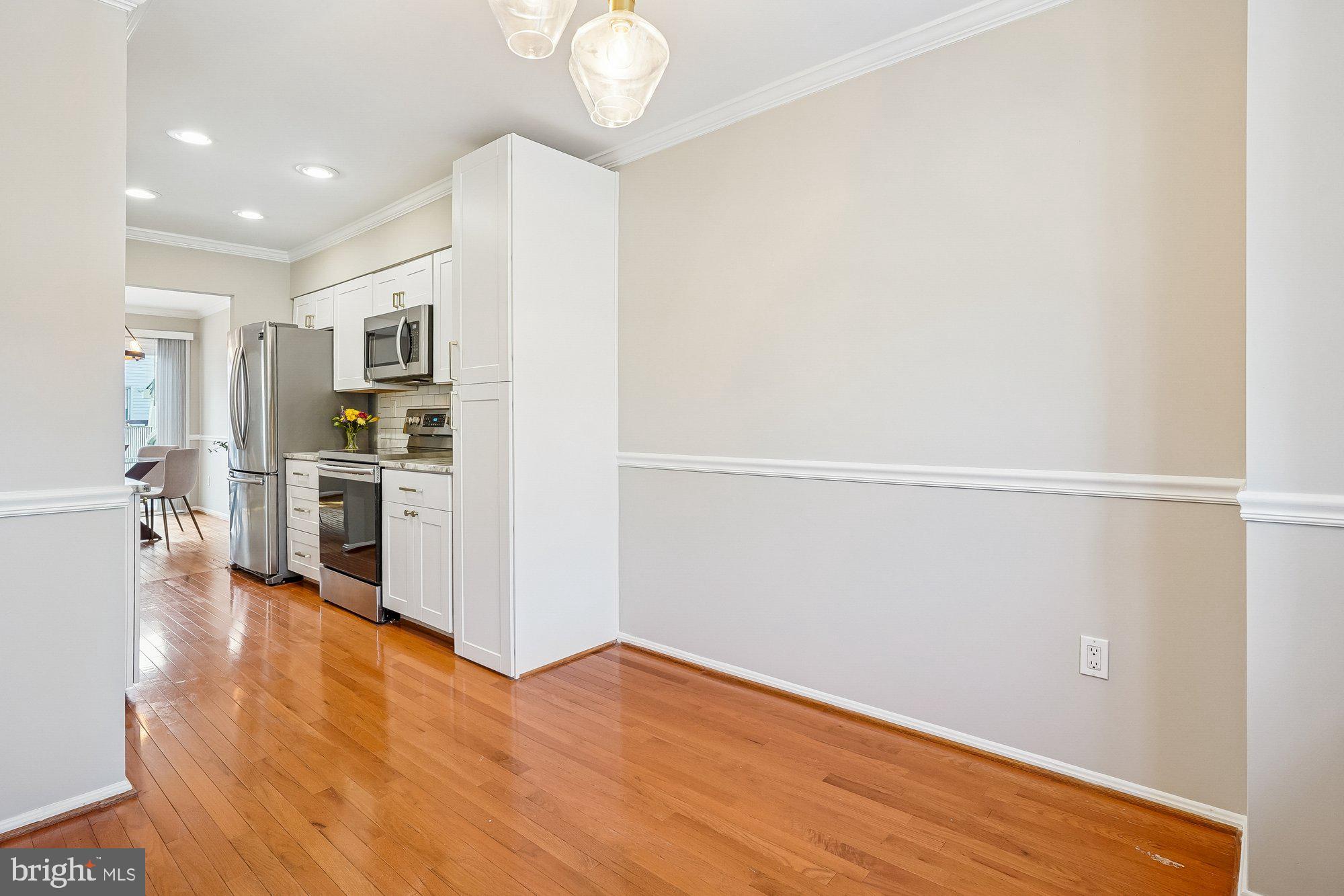 8826 Surveyors Place Springfield, VA 22152 - Photo 17 of 40 a view of a kitchen with wooden floor