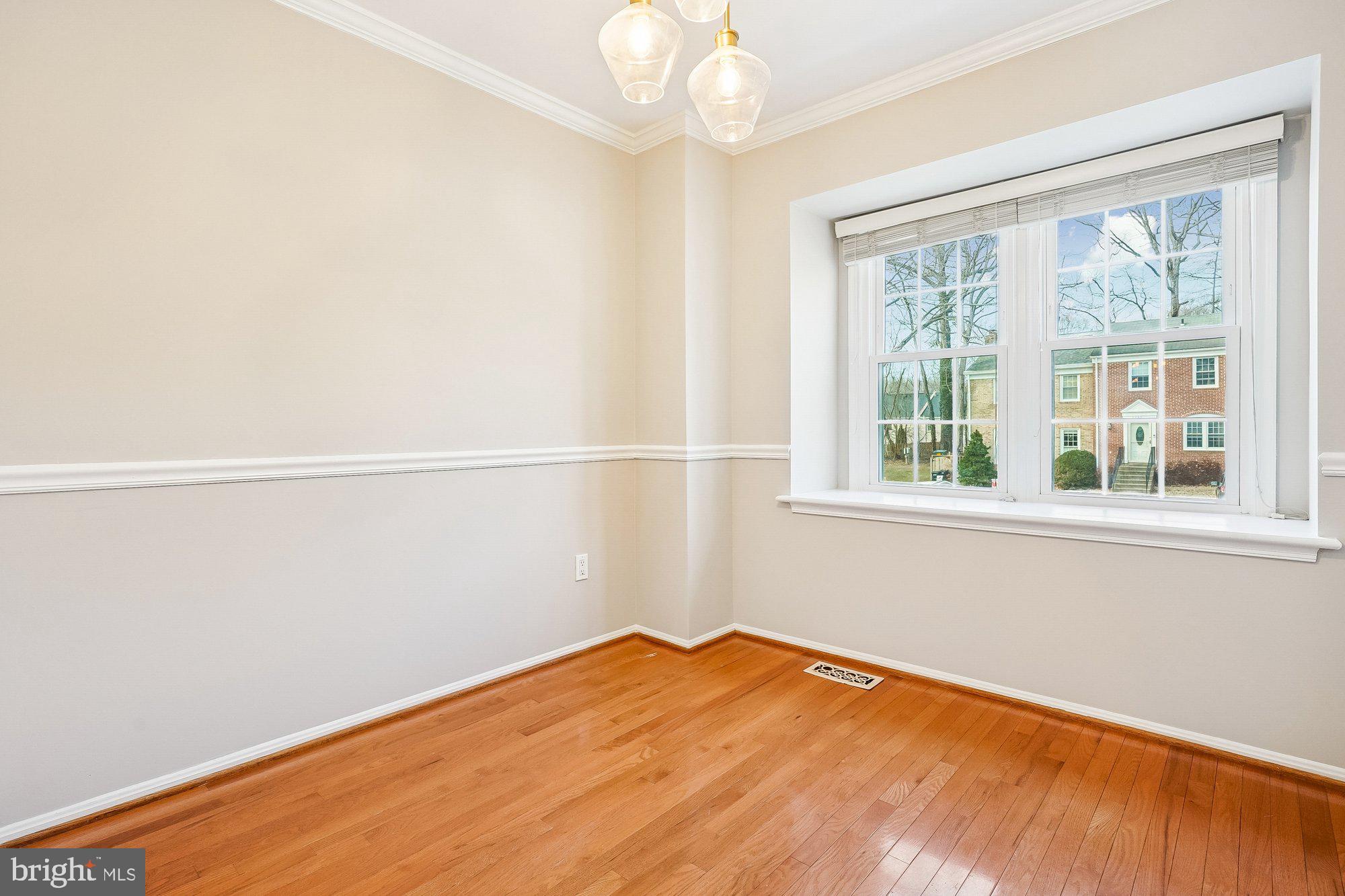 8826 Surveyors Place Springfield, VA 22152 - Photo 18 of 40 an empty room with a window