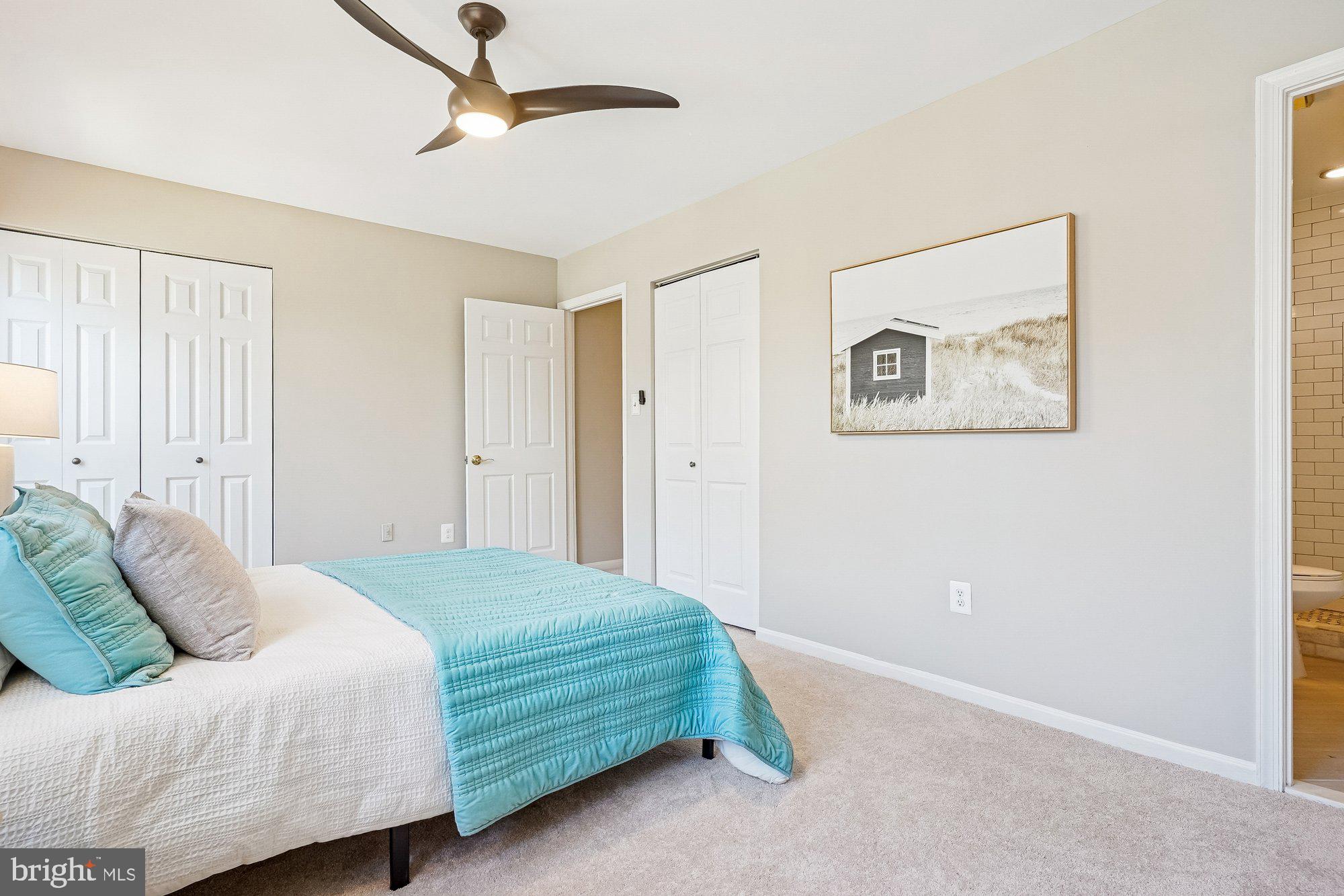 8826 Surveyors Place Springfield, VA 22152 - Photo 22 of 40 a bedroom with a bed and a painting