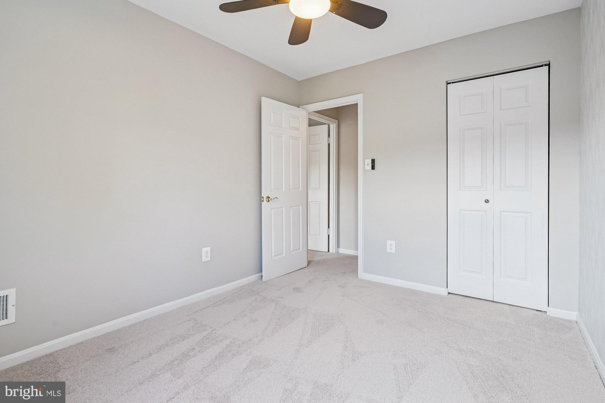 8826 Surveyors Place Springfield, VA 22152 - Photo 27 of 40 a view of an empty room and chandelier fan