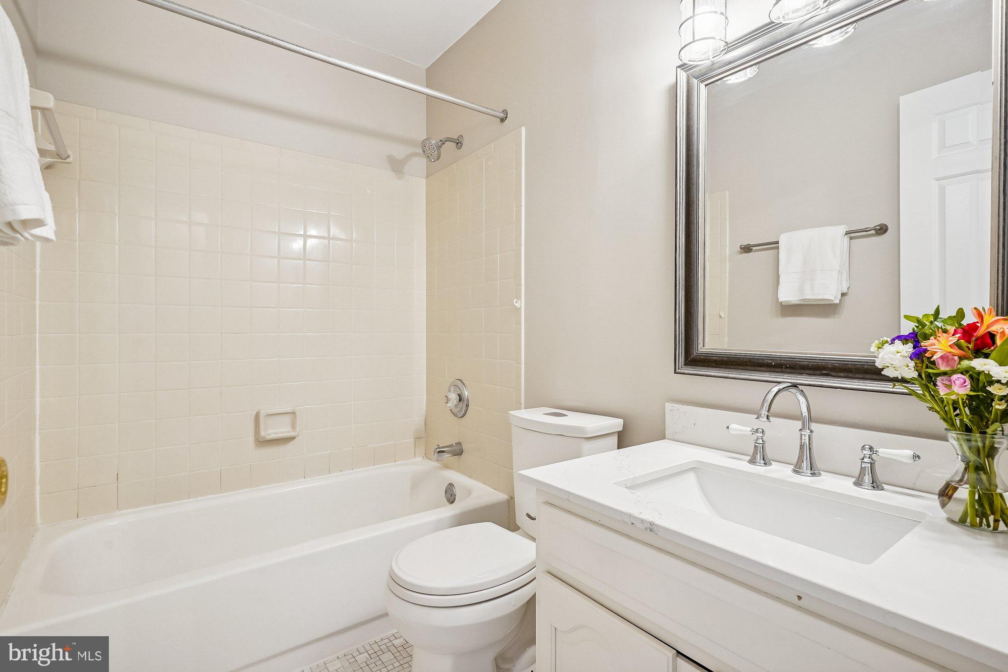 8826 Surveyors Place Springfield, VA 22152 - Photo 29 of 40 a bathroom with a sink toilet and shower