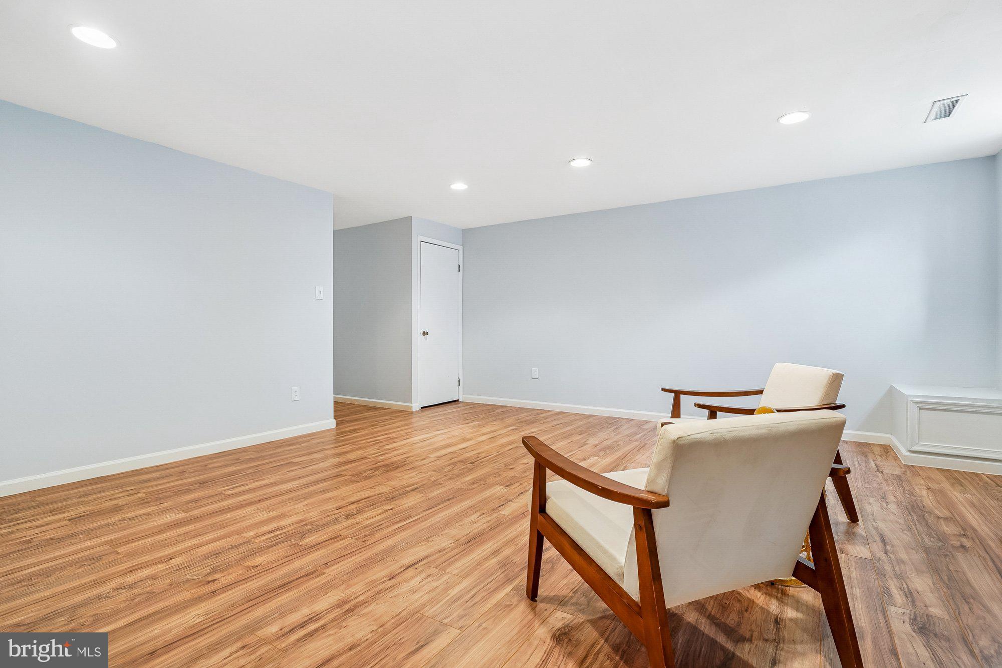 8826 Surveyors Place Springfield, VA 22152 - Photo 31 of 40 a workspace with furniture and wooden floor