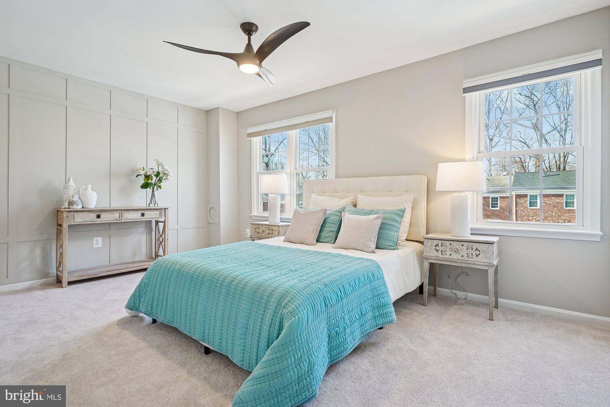8826 Surveyors Place Springfield, VA 22152 - Photo 3 of 40 a bedroom with a bed a table and window