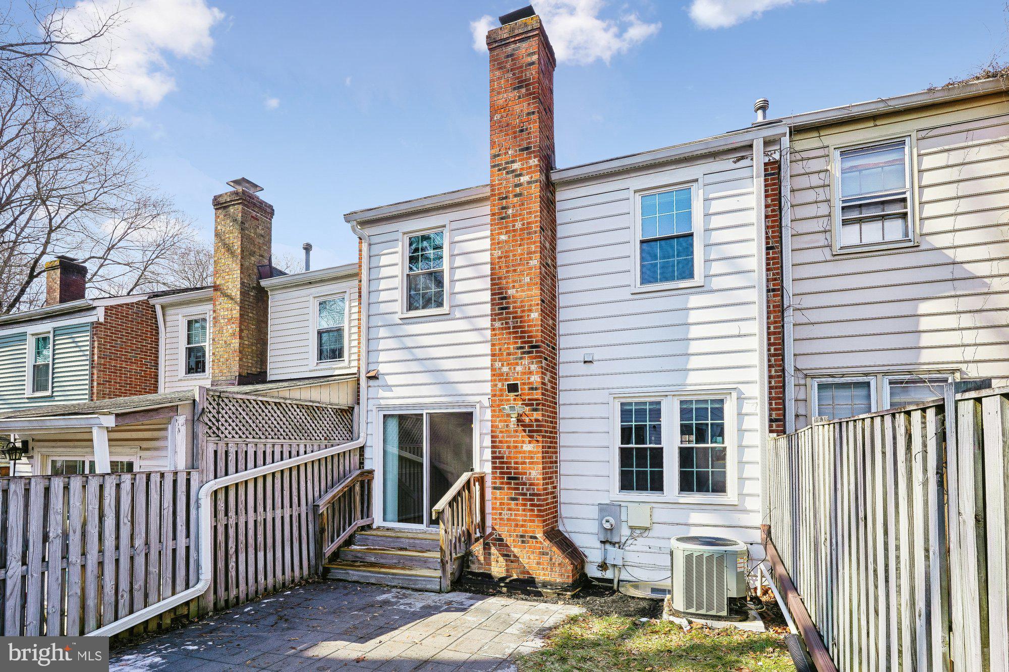 8826 Surveyors Place Springfield, VA 22152 - Photo 5 of 40 a front view of a house with a yard