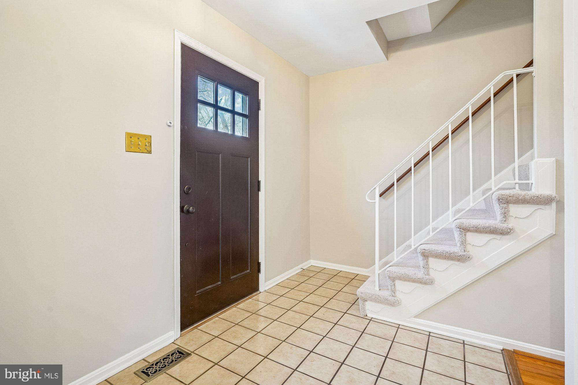 8826 Surveyors Place Springfield, VA 22152 - Photo 7 of 40 a view of an entryway with staircase