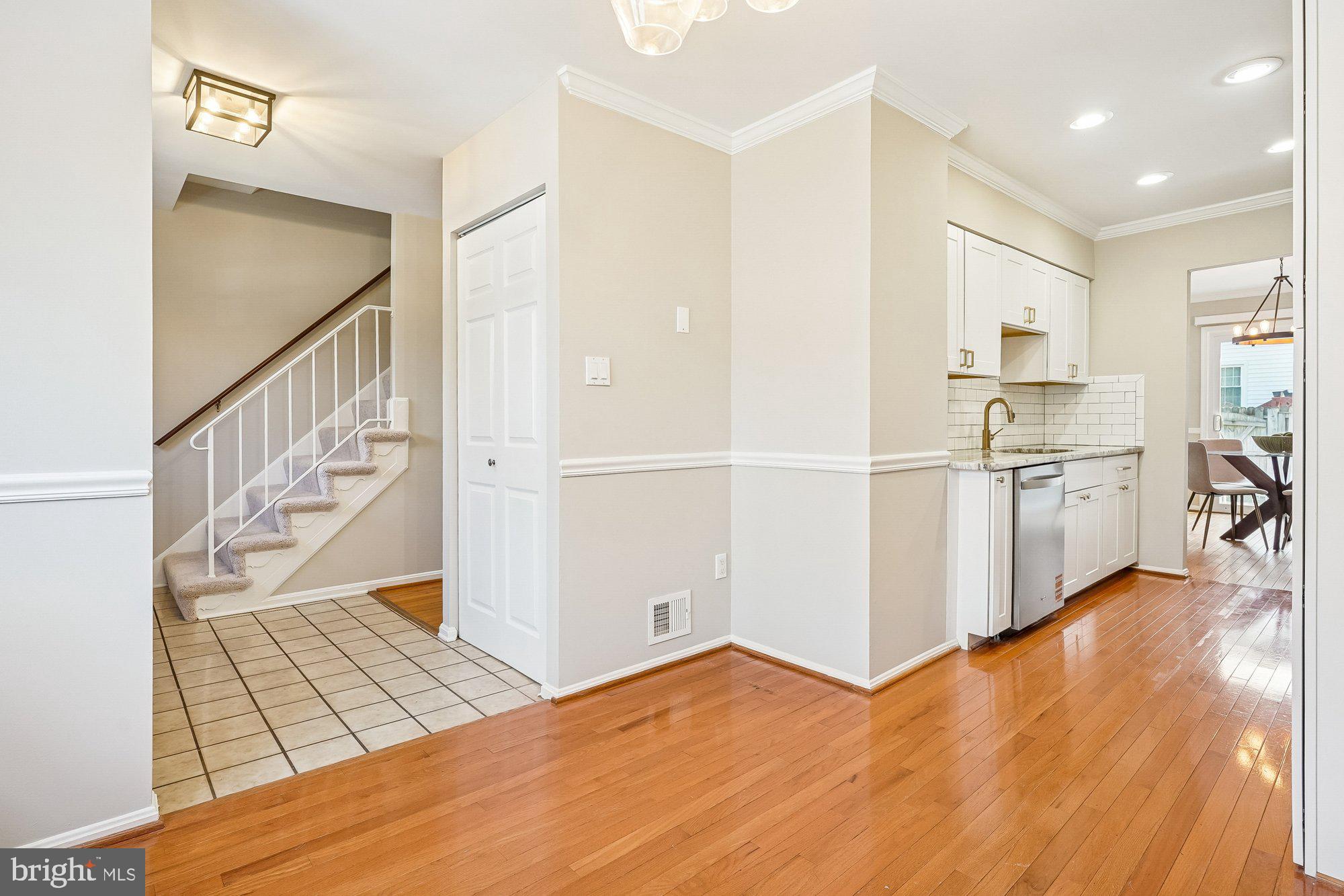 8826 Surveyors Place Springfield, VA 22152 - Photo 8 of 40 a view of kitchen with furniture and wooden floor